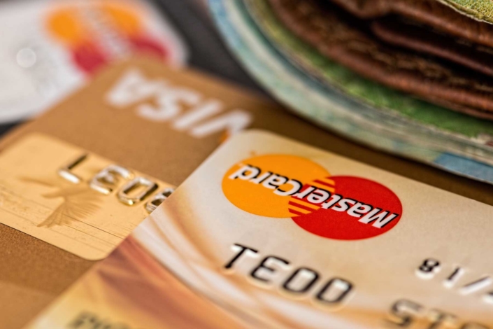 Visory-Bank-Reconciliation-Bookkeeping-header Close up of credit cards with a wallet in the foreground.