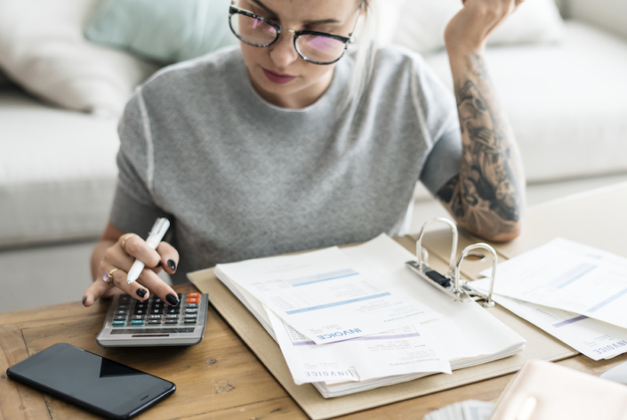 Woman with invoice bills Woman working on Accounts Receivable